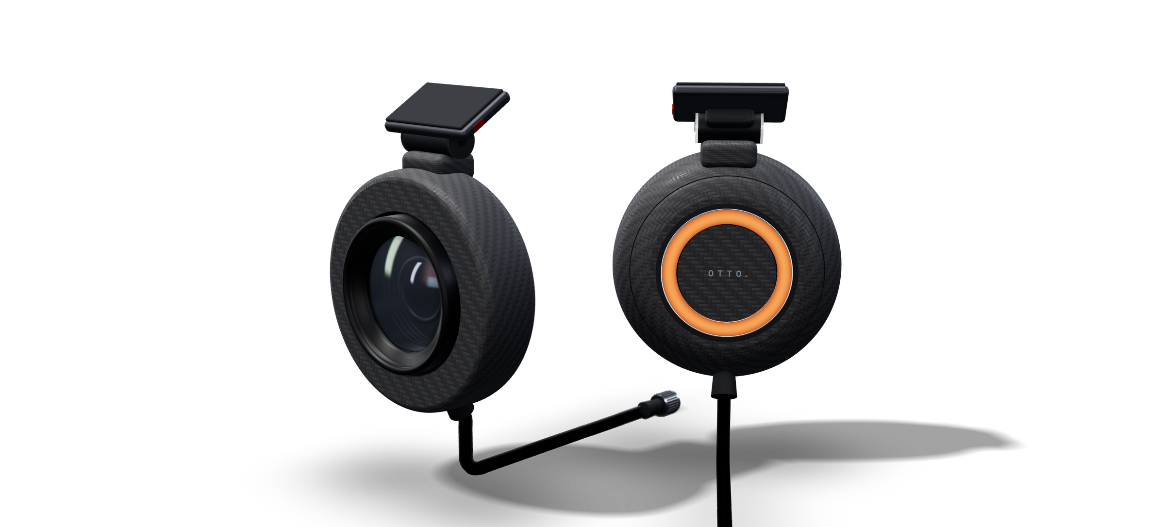 Render of the front and rear OTTO camera pods — matte carbon PP-CF pucks with glass mounts. One shows the large low-light lens behind a matte black hood; the other shows the cabin side, where the orange status ring faces the driver